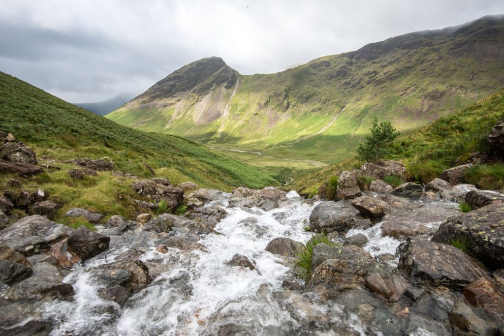 Mountains and a stream in the Lake District.